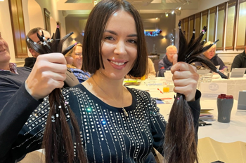 Community ambassador showing their latest fundraising initiative which was cutting their hair off.