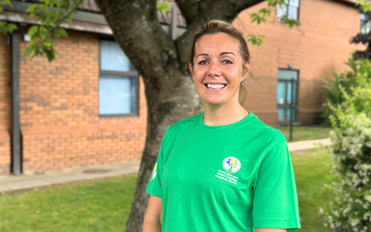 Sarah Nuttie, Consultant Midwife wearing a green charity fundraising T-shirt.